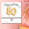 Charming 50th Birthday Gift Hamper: Gold Balloons, Bracelet, Chocolates & Candle